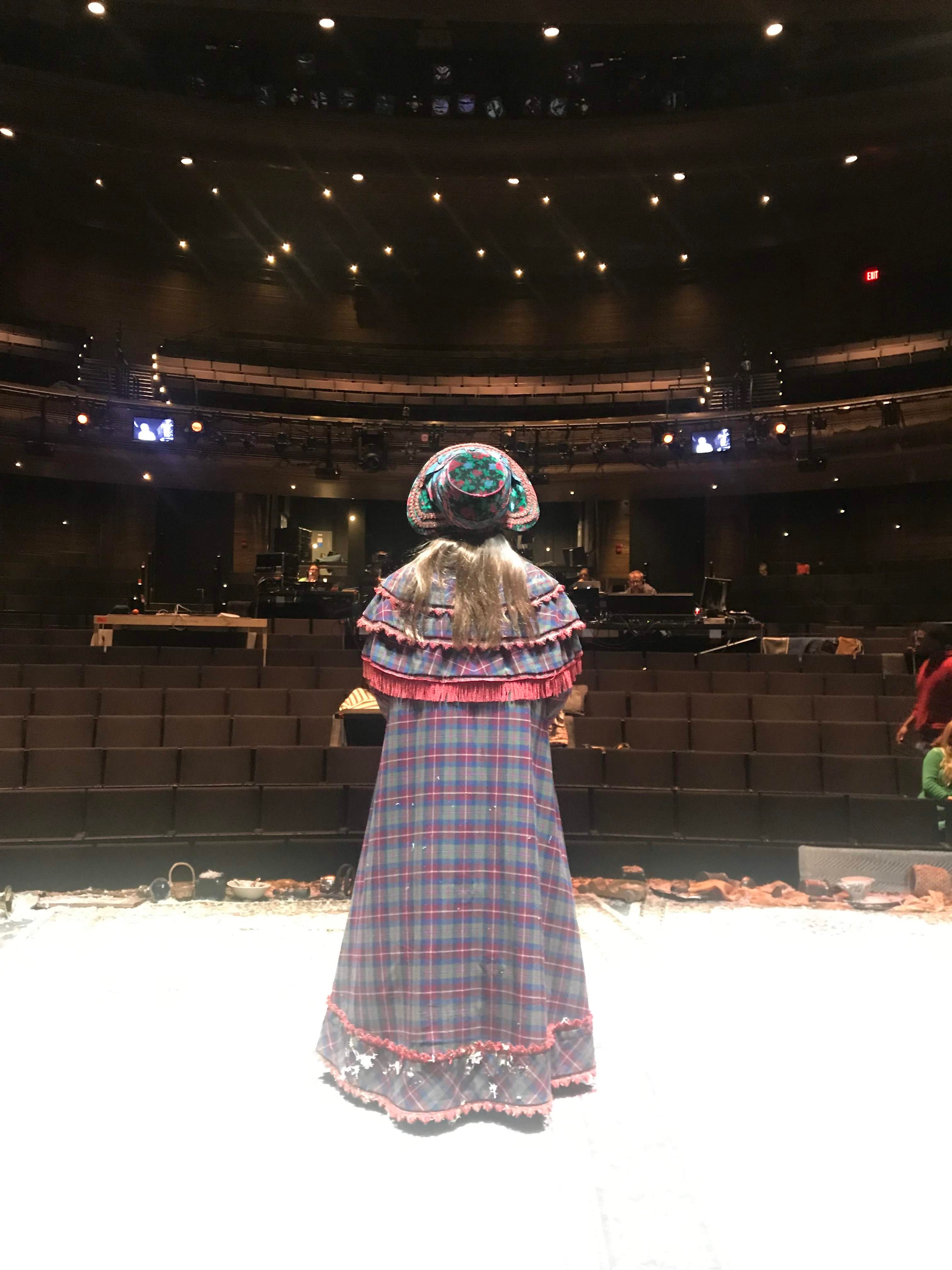 Bella on stage facing outwards